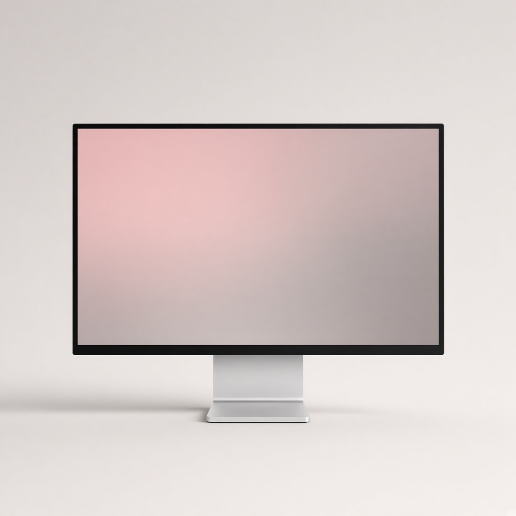 A slim monitor with a thin black bezel on a pale background